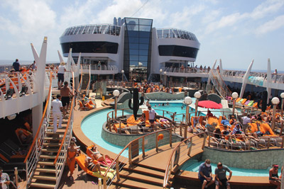 Swimming pool aboard the MSC Divina with sunbathers